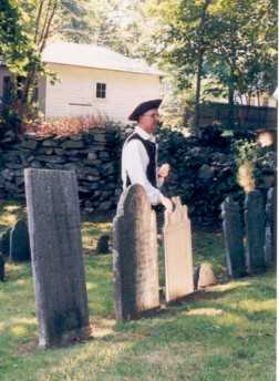 This guest speaker is standing behind a stone he is discussing... Note the effective lighting of the stone, which is done by an assistant with a mirror at a considerable distance away.